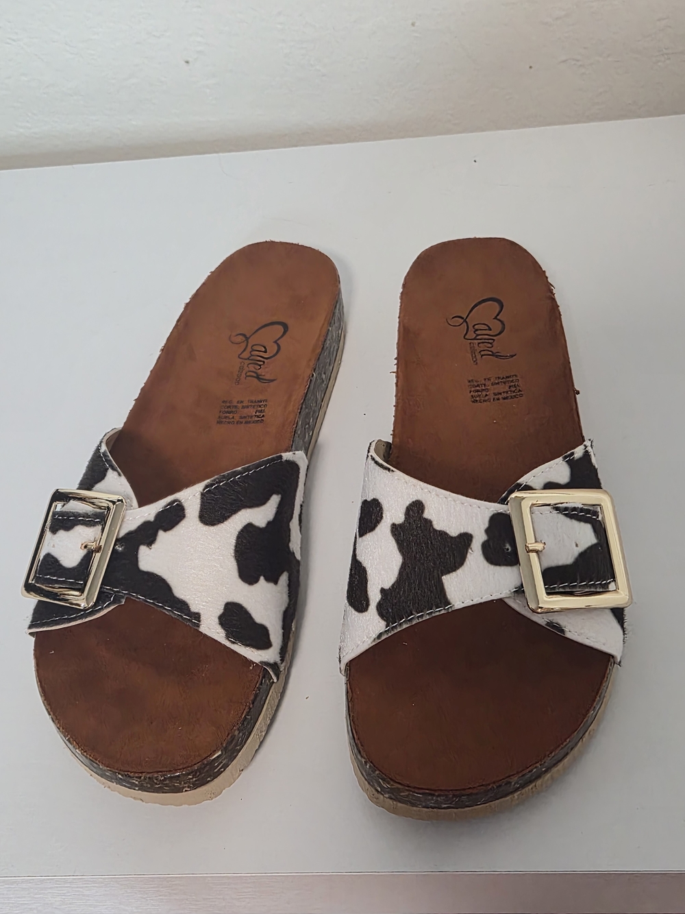 Women's Cow Print Slide Sandals with Gold Buckle